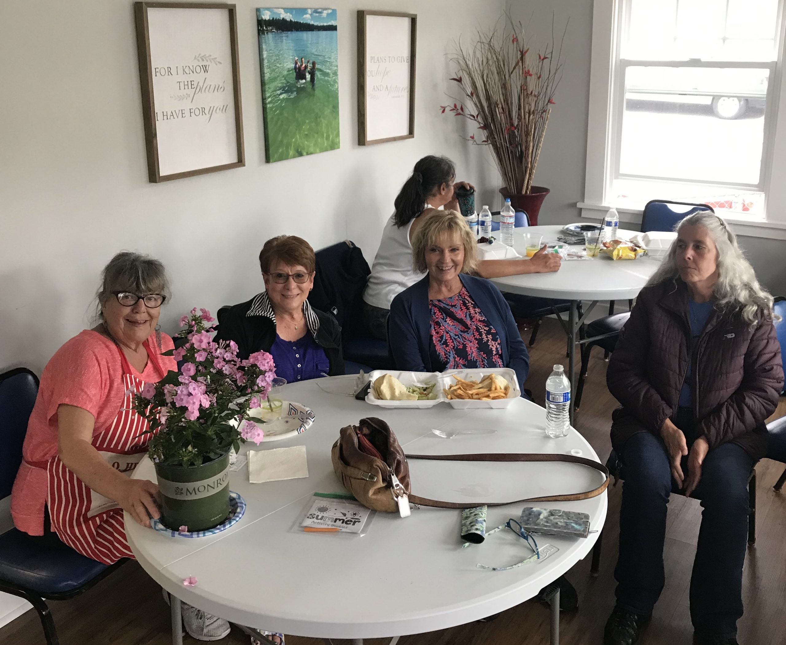 Women gathered around a table at Esther's Place